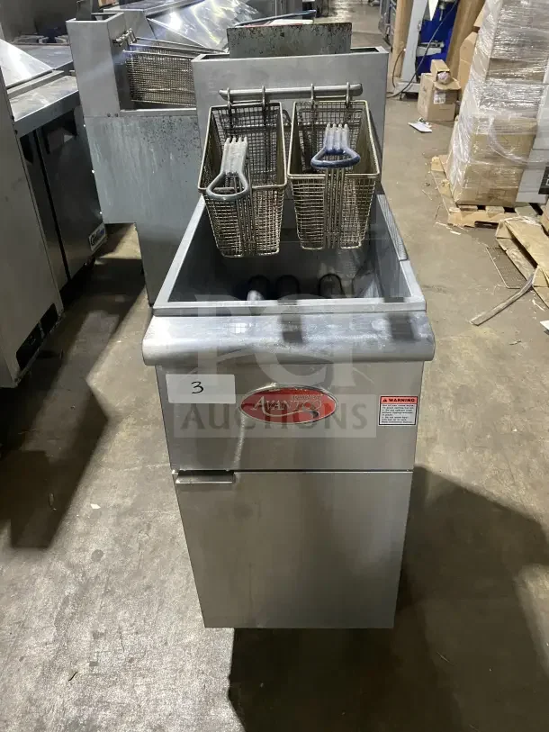 Avantco FF300N stainless steel deep fat fryer, natural gas, 2016 model, with backsplash, basket hanger, and fry baskets.