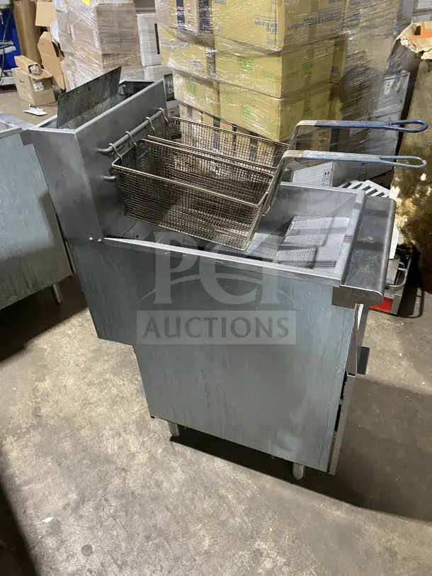 Avantco FF300N stainless steel natural gas fryer, 2016 model, with backsplash, basket hanger, and fry basket, SN: 20020370VA.