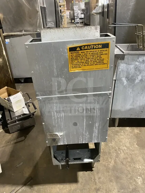 Avantco FF300N commercial stainless steel natural gas deep fat fryer with back splash and basket hanger, on legs, used.