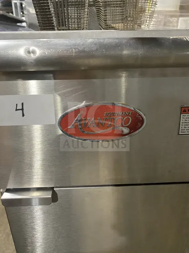 Avantco FF300N stainless steel natural gas fryer, 2016 model. Includes backsplash, basket hanger, fry basket. Serial No: 20020370VA.