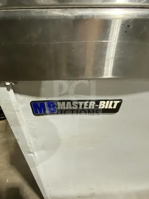 Master-Bilt DD88CG commercial ice cream dipping cabinet, 69" white with poly-coated rack, model label visible.