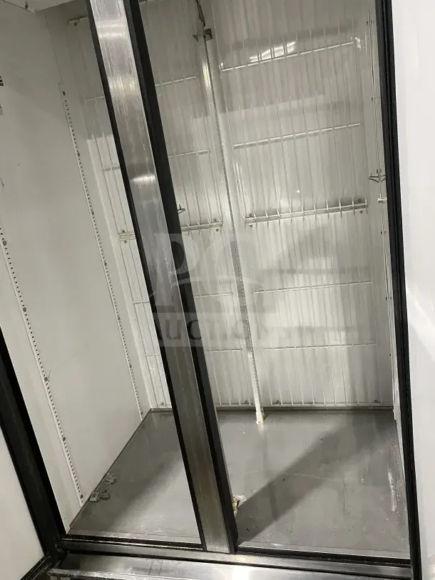True Commercial Stainless Steel 2 Door Reach-In Freezer, Model T35F, with poly-coated racks, on casters.
