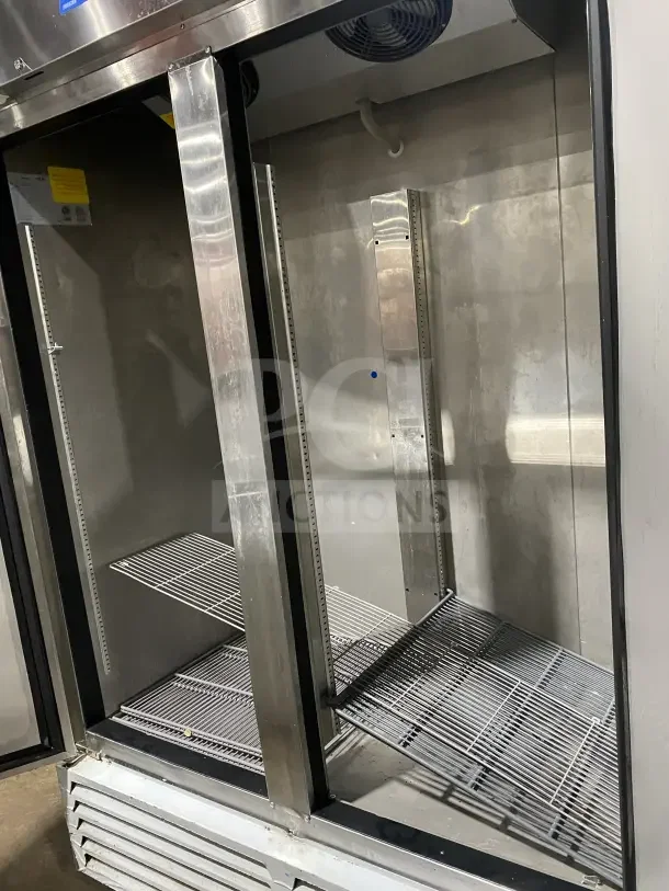 Asber ARF49HFHC 2-door reach-in freezer, stainless steel, 2022 model, on casters, 115V, 1 phase, interior view with shelves.