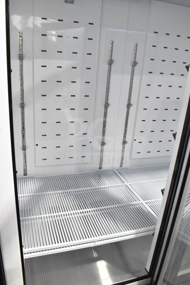 2022 Migali C-72RM-HC 3 Door Reach-In Cooler, new condition, commercial casters, interior shelving, 115V, 1 Phase.
