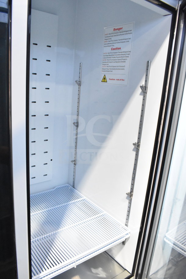 Migali C-72RM-HC 3 Door Cooler Interior, wire shelves, metal rails, warning label. Brand new, minor cosmetic flaws.