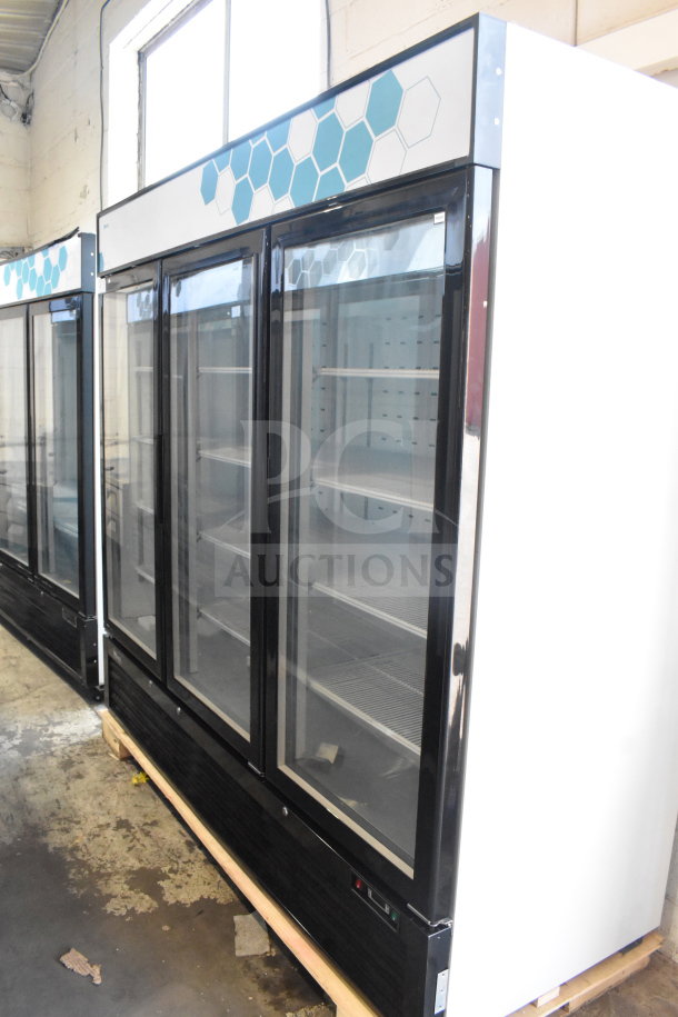 Brand new Migali C-72RM-HC commercial 3-door reach-in cooler merchandiser on casters, 115V, with slight scratches.