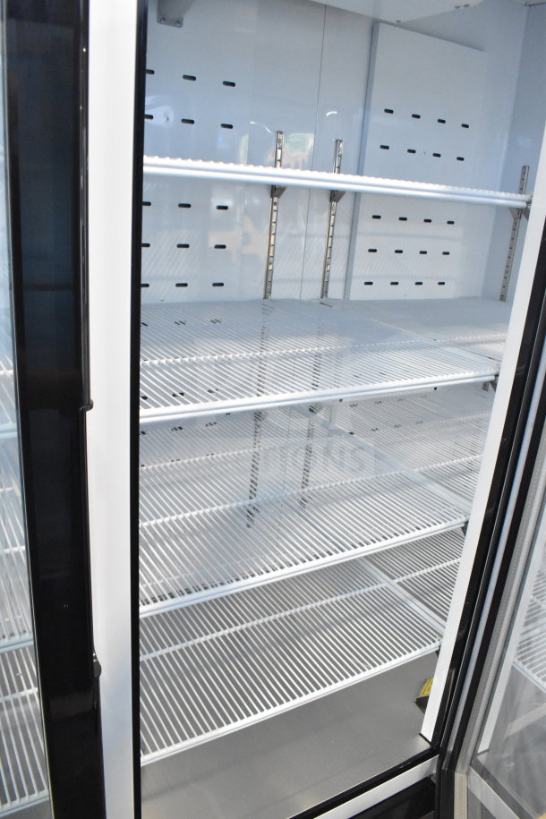 Migali C-72RM-HC cooler, 3-door reach-in, commercial casters, brand new scratch and dent, 115V, interior shelves.