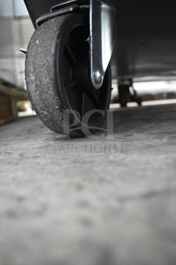 Close-up of caster wheel on a Migali C-CB72-HC commercial chef base. New, with scratch and dent condition. Model 2024.