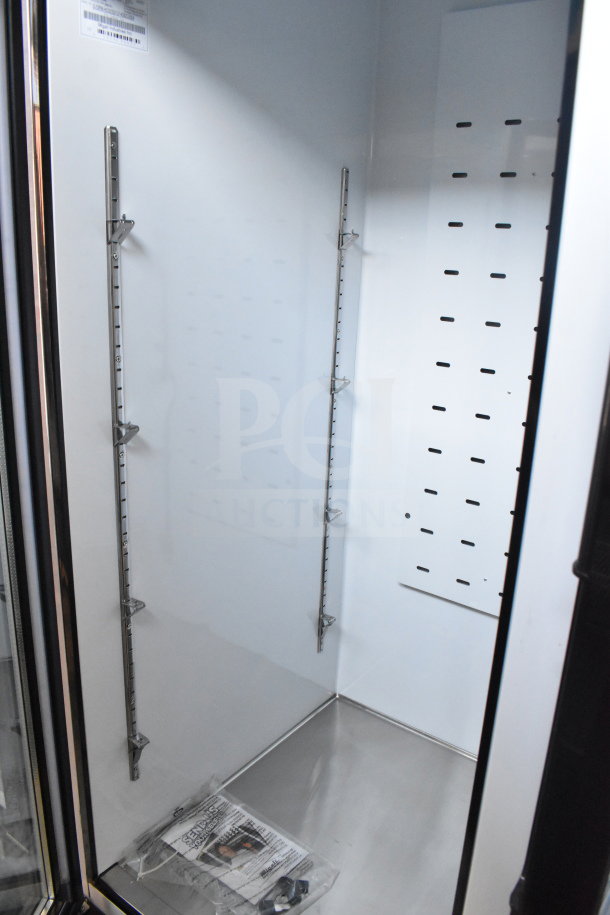 Brand new Migali C-72FM-HC 3-door reach-in freezer; scratch and dent condition; commercial casters included.