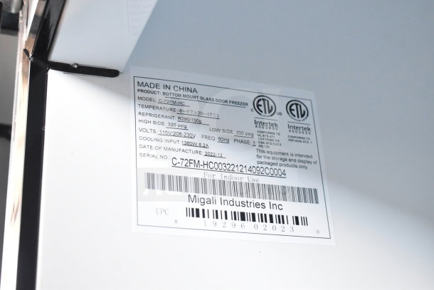 BRAND NEW SCRATCH AND DENT 2022 Migali C-72FM-HC 3-door freezer sticker showing model, voltage, and serial number.