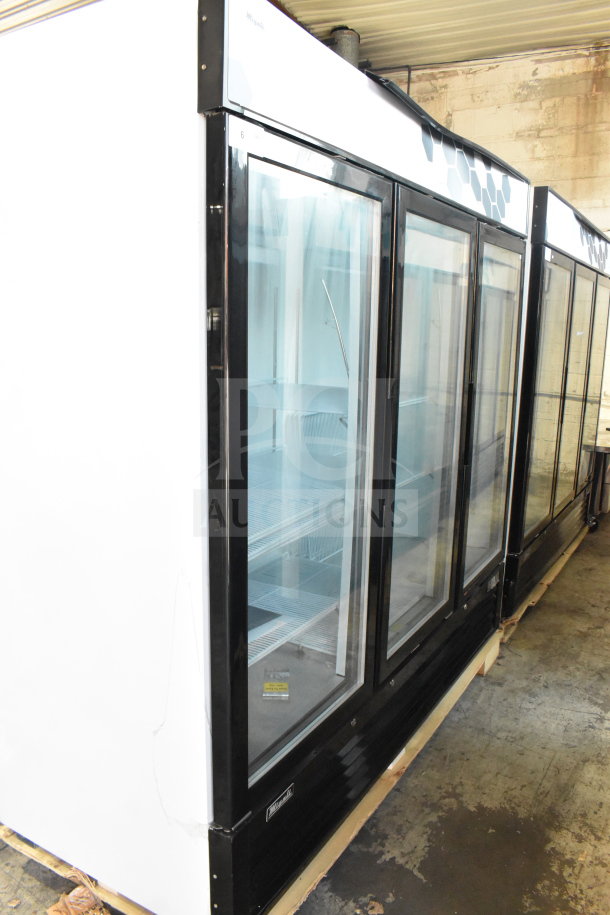 2019 Migali C-72FM commercial 3-door reach-in freezer merchandiser, brand new with minor scratches. Model C-72FM.