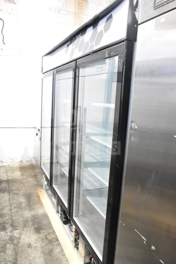 Migali C-72FM 3-door commercial freezer merchandiser. New scratch and dent condition. 115/208-230V, 1 Phase. Serial C-72FM00319062000920001.