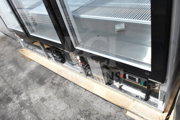 Brand new Migali C-72FM 3-door reach-in freezer merchandiser, 115/208-230V, 1 phase, showing scratch and dent details.