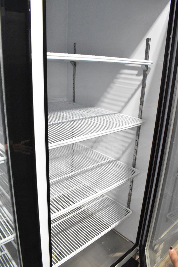 Brand new 2019 Migali C-72FM commercial 3-door reach-in freezer merchandiser, scratch and dent, with adjustable shelves.