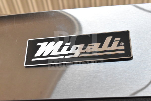 Migali C-3R-HC commercial cooler, 3 doors, on casters, brand new scratch and dent, 115V, 1 phase, serial visible.