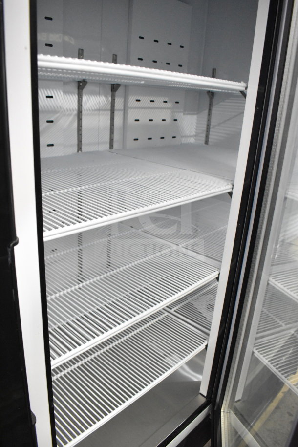 Migali C-72FM-HC 2020 3-door reach-in freezer, new condition, with shelves; on commercial casters; 115/208-230V, 1 Phase.