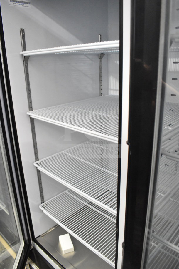 Migali C-72FM-HC 3-door freezer interior, adjustable wire shelves, commercial-grade; new with scratch and dent condition.