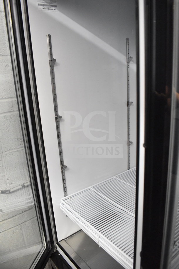 Brand new Migali C-72FM-HC 3-door reach-in freezer with shelving, on commercial casters, 115/208-230V, 2022 model.