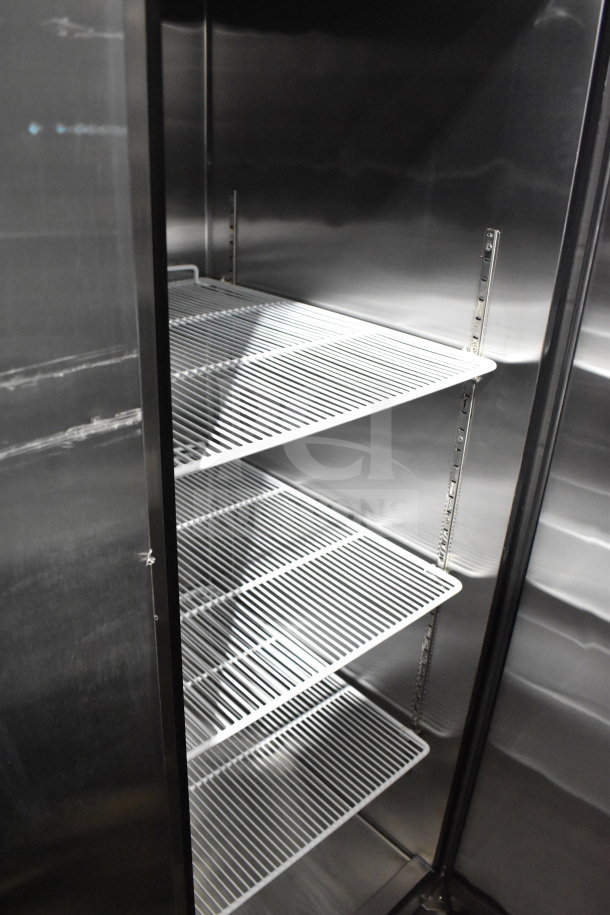 Migali C-3R commercial freezer interior with adjustable wire shelves. New condition with minor scratches. Serial C-3RUSB100317022100920017.