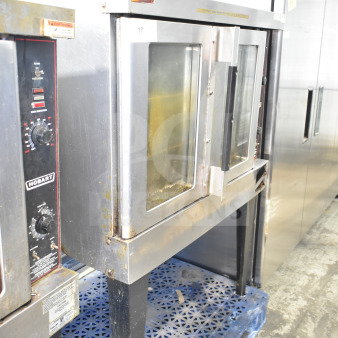 Hobart full-size convection oven with view-through doors, thermostatic controls, and metal legs. Visible wear.
