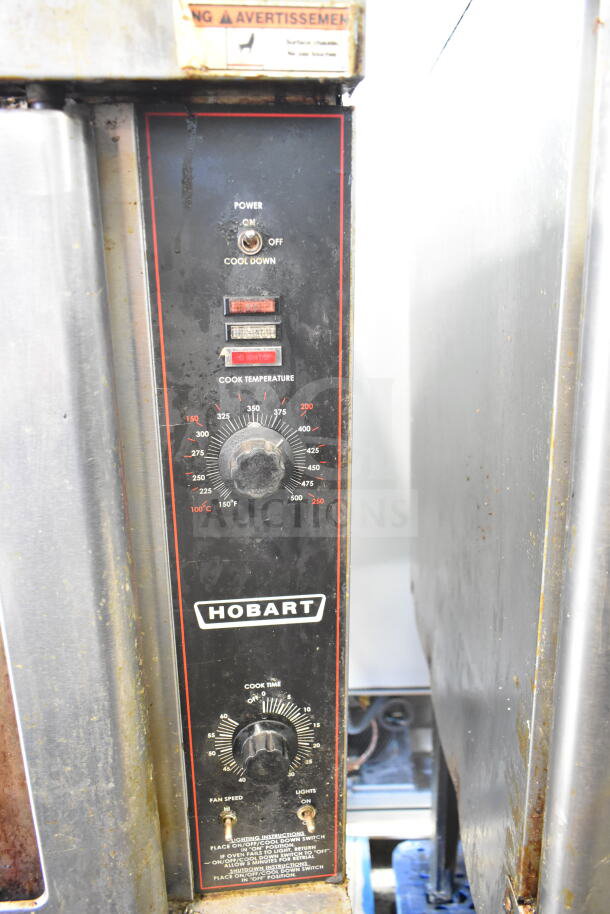 Hobart commercial gas convection oven control panel with temperature dial, power switch, and warning label.
