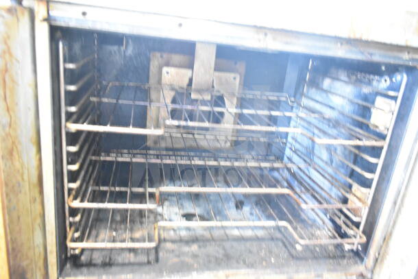 Hobart commercial gas convection oven with view-through doors, thermostatic controls, metal legs, showing interior racks.