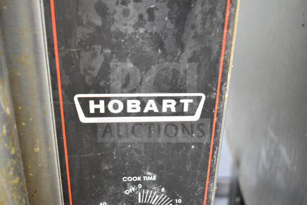 Hobart commercial gas convection oven with view-through doors, thermostatic controls, and metal legs. Good condition.