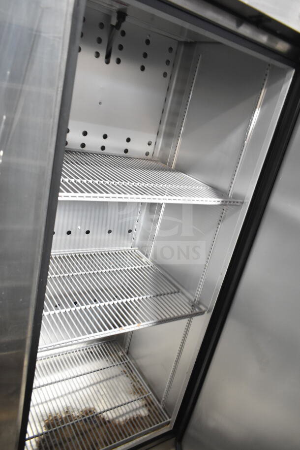 True Commercial Single Door Reach In Freezer, 115V, 1 Phase, stainless interior, adjustable shelves, clean condition.