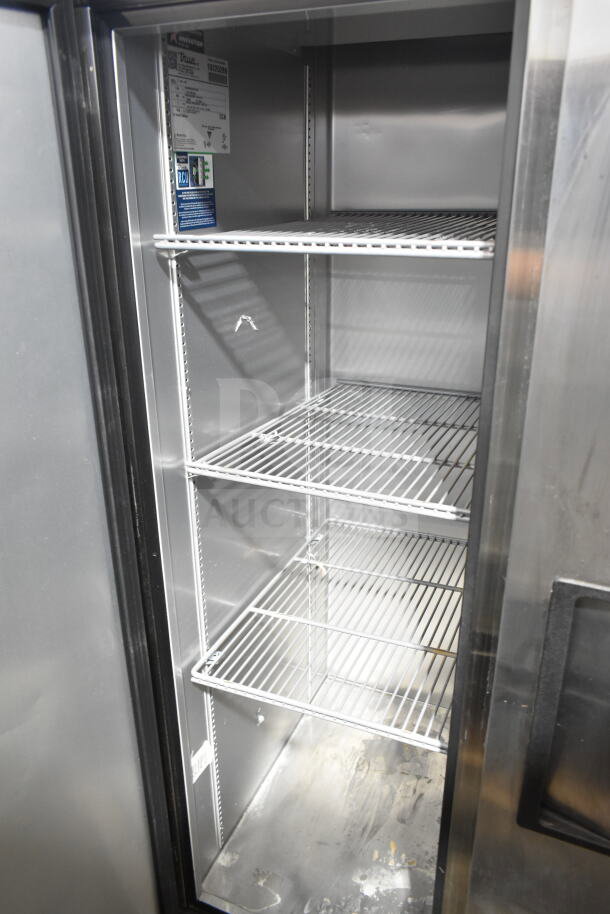 2022 True T-35-HC Commercial 2-Door Reach-In Cooler, 115V, 1 Phase, with metal shelves, clean interior, and visible model label.