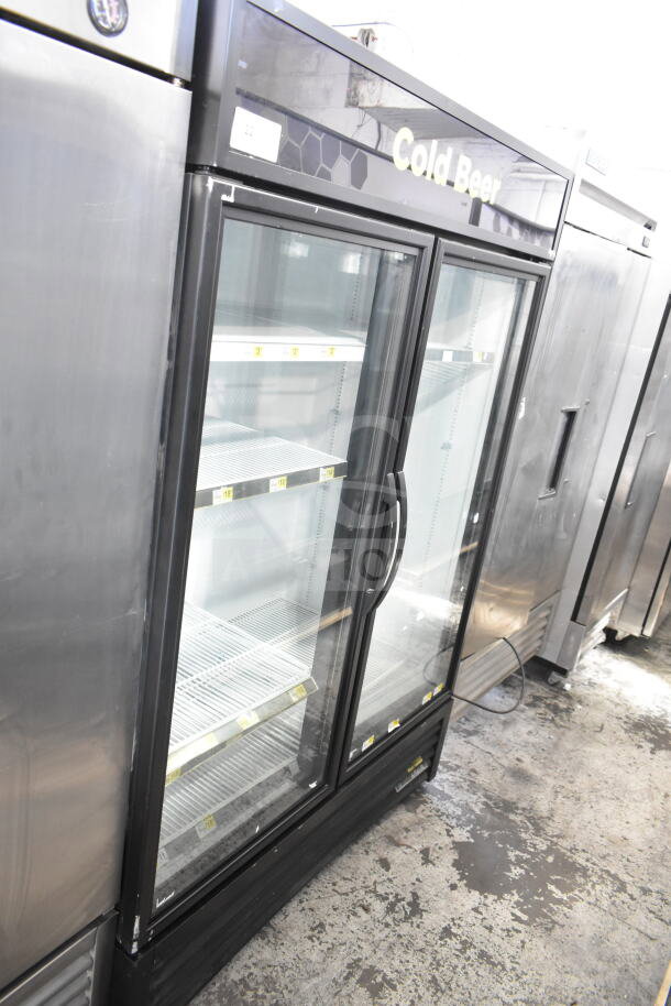 2019 True GDM-49-HC commercial 2-door cooler merchandiser, glass doors, 115V, 1 phase, labeled "Cold Beer," good condition.