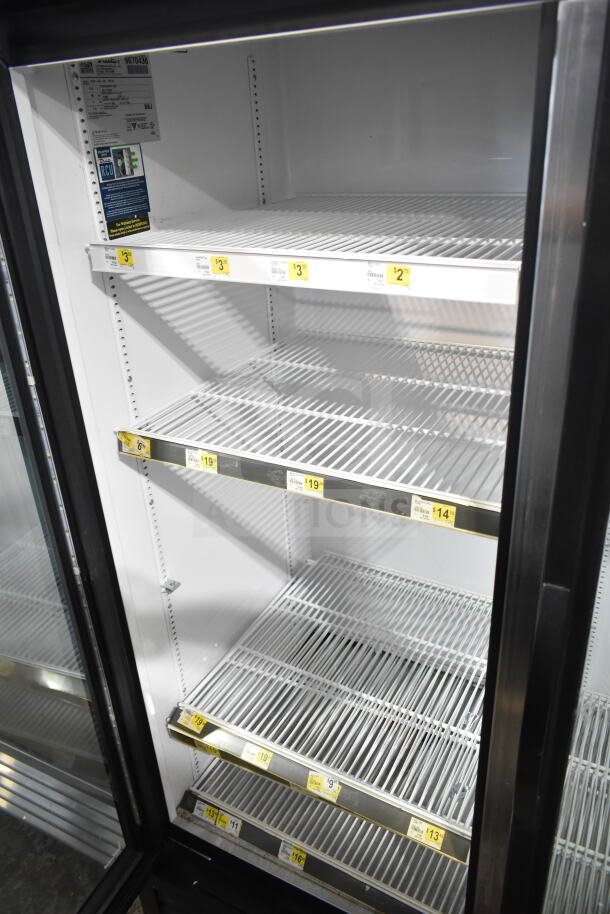 2019 True GDM-49-HC commercial 2-door cooler, 115V, 1 phase. Features spacious shelving and price tags. Clean condition.