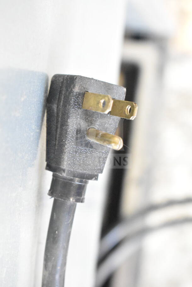 Close-up of a black electrical plug for the 2017 True T-35 Commercial Reach In Cooler, 115 volts, 1 phase.