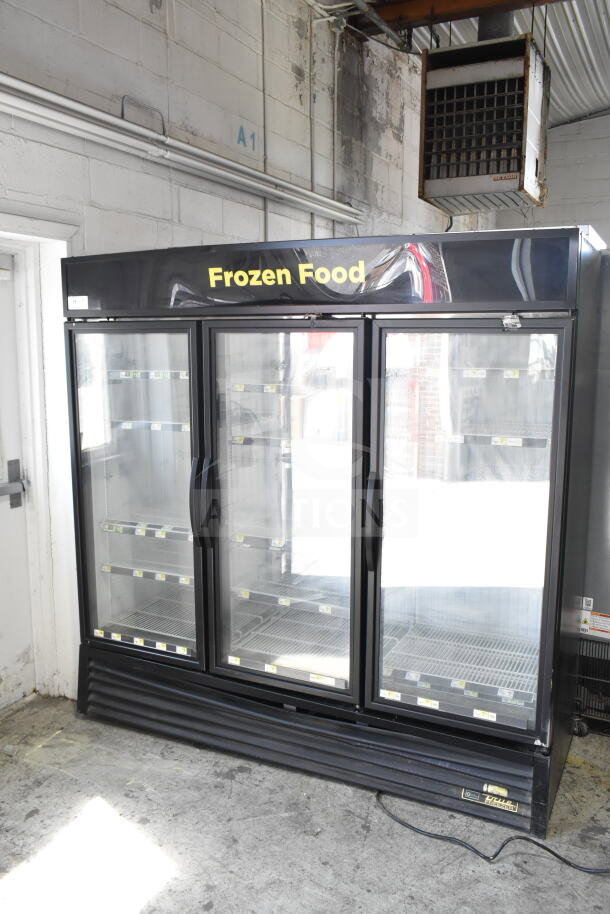 2016 True GDM-72F-HC commercial freezer with 3 glass doors, black finish, used condition, 115/208-230V, 1 phase.