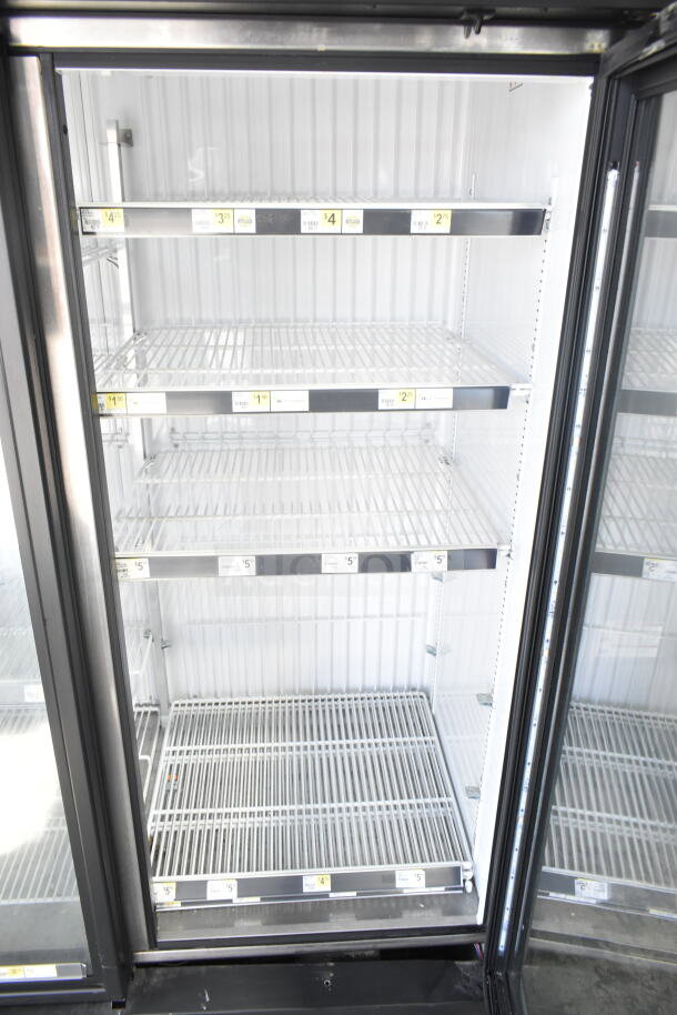 2016 True GDM-72F-HC 3 Door Reach In Freezer, commercial-grade, glass doors, adjustable shelves, excellent condition.