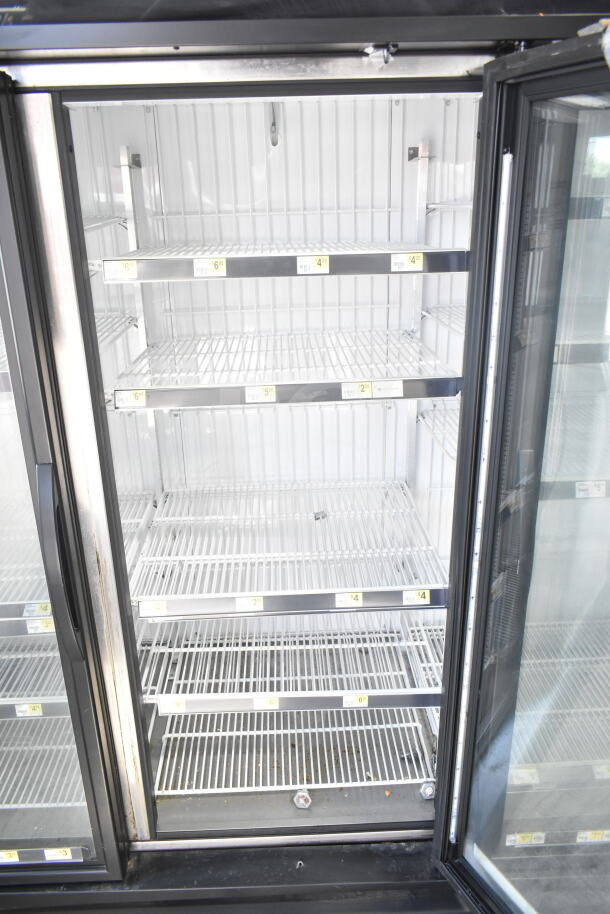 2016 True GDM-72F-HC commercial 3-door reach-in freezer merchandiser. Visible shelving, clean interior. 115/208-230V, 1 phase.