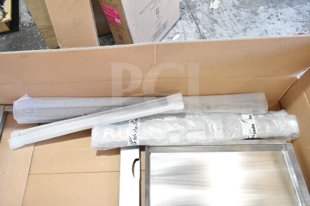 Brand new Fri-jado Spit Trolley Large, in packaging. Contains wrapped components with visible Fri-jado label. Scratch and dent condition.