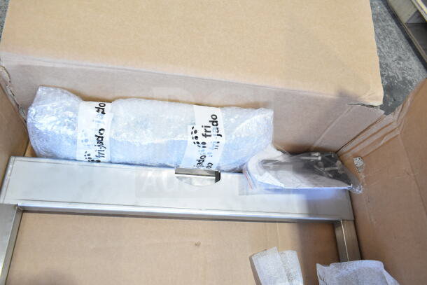 Brand new Fri-jado Spit Trolley Large, in packaging with minor scratches and dents, labels visible, in original box.
