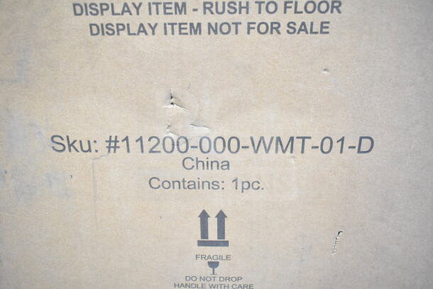 Cardboard box with visible scratches. Labels show SKU: #11200-000-WMT-01-D, marked as display item, fragile. Contains 1 piece.