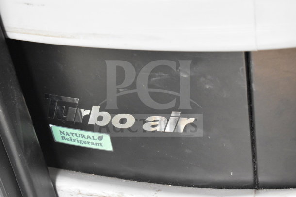 Turbo Air TIOM-48RRB-N 48" black air curtain display case on casters, features "Natural Refrigerant" label.