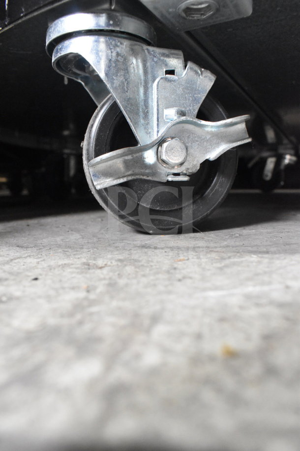 Turbo Air TIOM-48RRB-N commercial display case caster, silver metal and black rubber wheel, suitable for easy mobility.