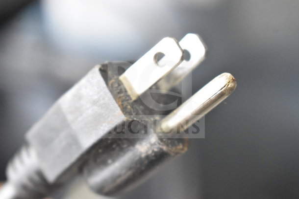 Close-up of a slightly worn power plug for Avantco 177S600 Commercial Countertop Soup Kettle Food Warmer, 120 Volts.
