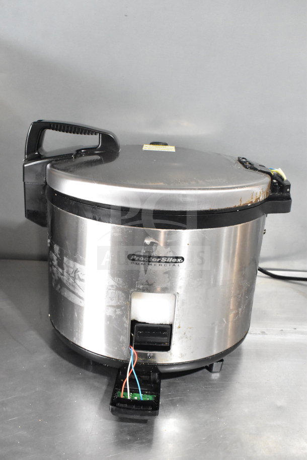 Proctor Silex GR05 Commercial Rice Cooker, 120 Volts, stainless steel, used condition, visible wear, wiring exposed.