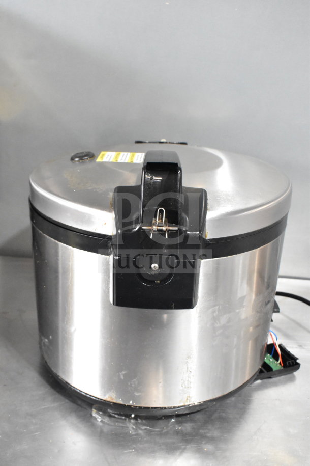 Proctor Silex GR05 commercial rice cooker, stainless steel, 120 volts, 1 phase. Visible wear on exterior.