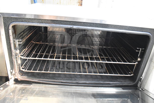 Moffat Turbofan E27M3 convection oven, electric, 208 volts, commercial countertop, interior racks, visible wear.