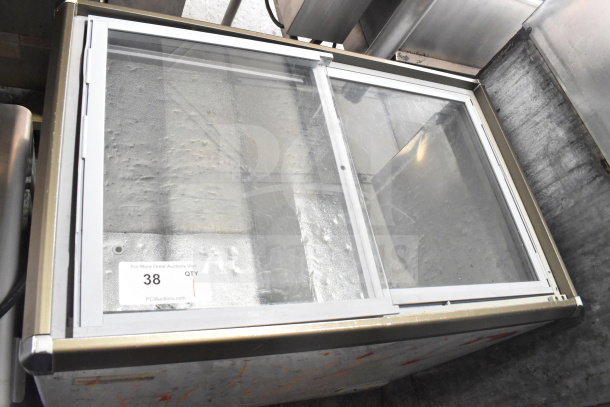 Omcan XS-200 Chest Freezer Merchandiser, 110V, 1 Phase. Sliding glass top, visible label with model information. Good condition.