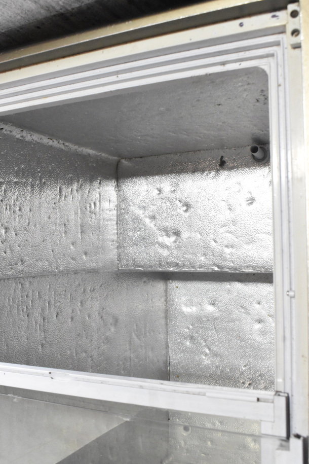 Omcan XS-200 Chest Freezer Merchandiser interior, showcasing metal lining and insulation. Model: XS-200, 110V, 1 Phase.