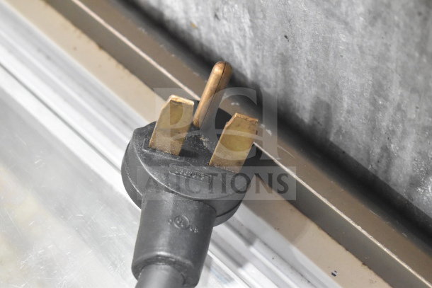 Power plug of a 2022 Turbochef Encore 2 commercial rapid cook oven, 208/240V, 1 phase, close-up view.