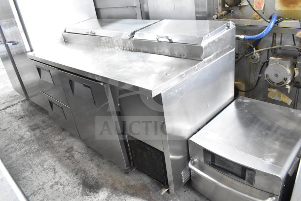 True TPP-67D-2 commercial pizza prep table with door and 2 drawers, stainless steel, excellent condition, 115 volts, 1 phase.