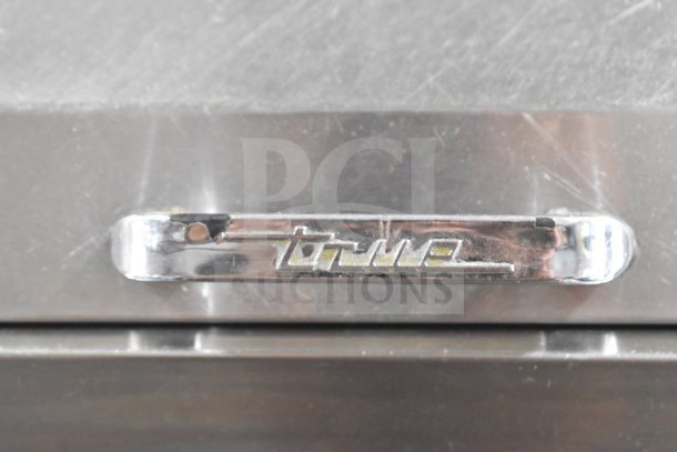 True TPP-67D-2 Commercial Pizza Prep Table featuring door and 2 drawers. Stainless steel, 115V, 1 phase. Logo visible.
