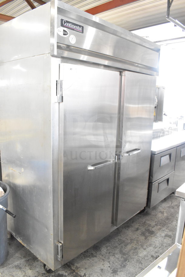 Continental 2RE Commercial 2-Door Reach-In Cooler on casters, stainless steel, 115V, 1 Phase, visible brand label.